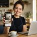 Melbourne cafe owner showing a mobile-first website design on a smartphone